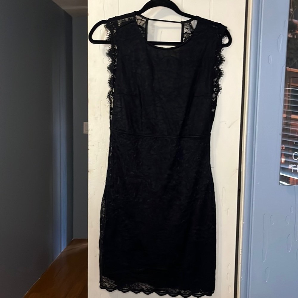 Sleeveless black lace mini dress